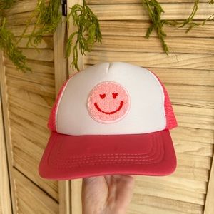Pink smiley face hat